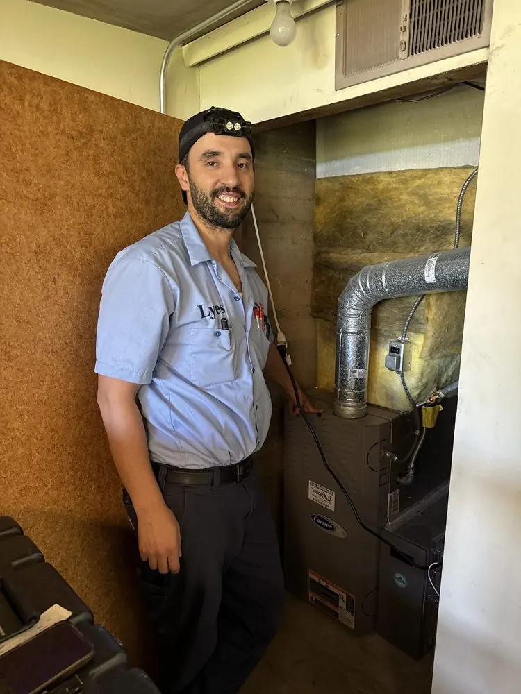 Lyes Bouhazem, owner of Velair, beside a furnace he serviced.